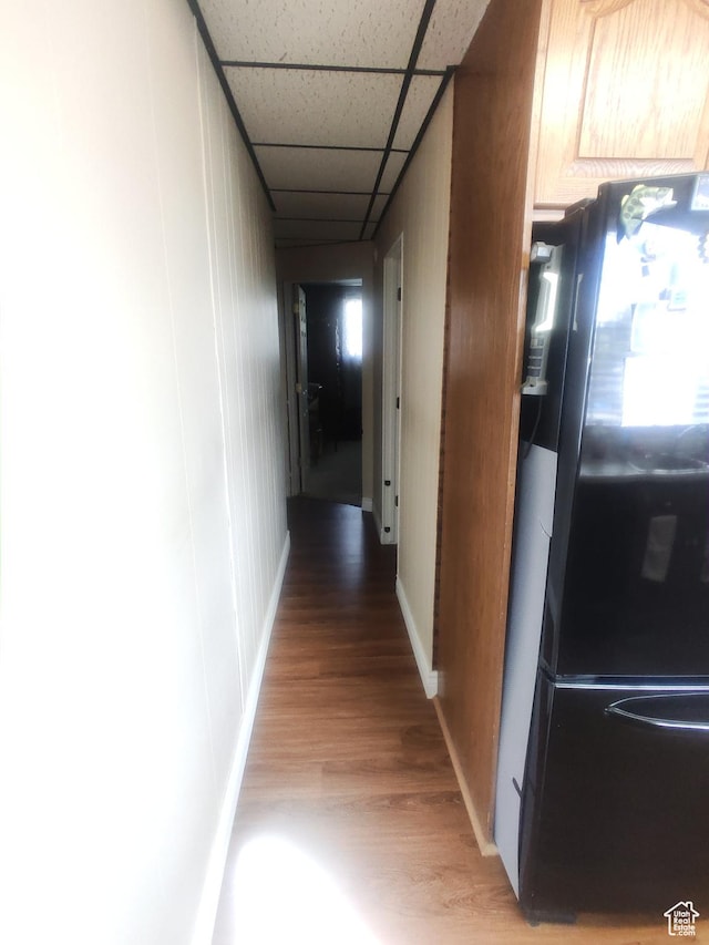 217 Wilkins, East Carbon, UT 84520 - corridor with light wood-type flooring and a paneled ceiling