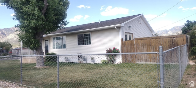 217 Wilkins, East Carbon, UT 84520 - view of side of property with a mountain view and a fenced backyard