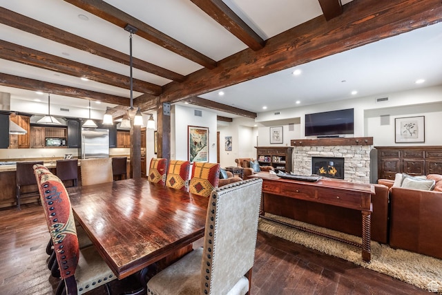 1825 Three Kings Dr Unit 3101, Park City, UT 84060 - dining room with dark wood-style flooring, beamed ceiling, a stone fireplace, and recessed lighting