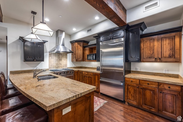 1825 Three Kings Dr Unit 3101, Park City, UT 84060 - kitchen with wall chimney exhaust hood, stainless steel built in fridge, stove, dark wood-style floors, and a peninsula