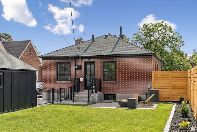 2487 S Beverly St E, Salt Lake City, UT 84106 - rear view of property featuring a fenced backyard, a shingled roof, brick siding, and a chimney