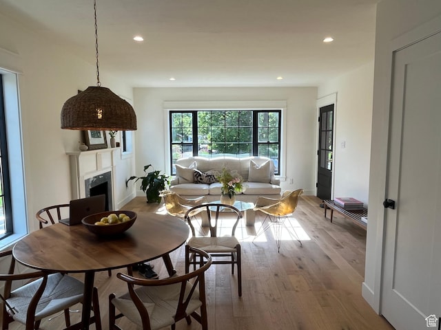 2487 S Beverly St E, Salt Lake City, UT 84106 - dining space with wood finished floors, recessed lighting, and a fireplace