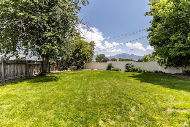5655 S 700 W, Murray, UT 84123 - fenced backyard featuring a mountain view