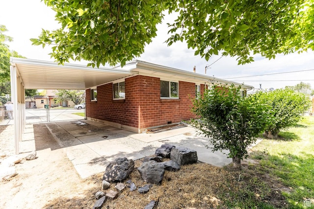 5655 S 700 W, Murray, UT 84123 - view of home's exterior with an attached carport and brick siding