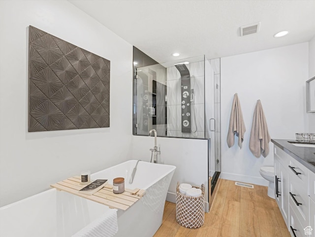 14735 S Asher Ln W, Bluffdale, UT 84065 - full bathroom with vanity, a stall shower, wood finished floors, a soaking tub, and recessed lighting