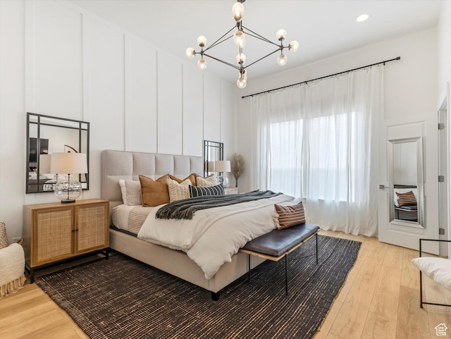 14735 S Asher Ln W, Bluffdale, UT 84065 - bedroom with light wood-style floors and a chandelier