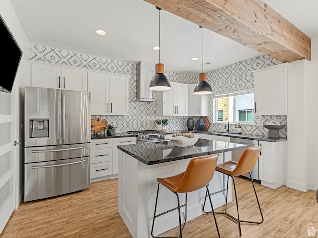 14735 S Asher Ln W, Bluffdale, UT 84065 - kitchen with appliances with stainless steel finishes, wall chimney range hood, white cabinets, light wood-type flooring, and recessed lighting