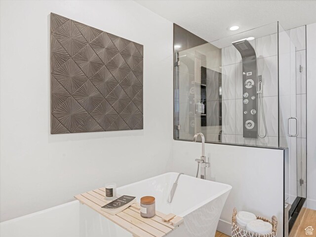 14735 S Asher Ln W, Bluffdale, UT 84065 - bathroom with a shower stall, a freestanding bath, and recessed lighting