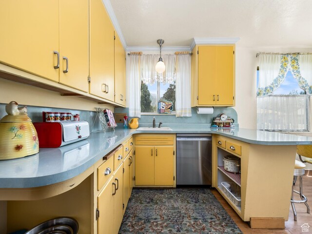 920 S 150 E, Orem, UT 84058 - kitchen featuring stainless steel dishwasher, a peninsula, a kitchen bar, crown molding, and tasteful backsplash
