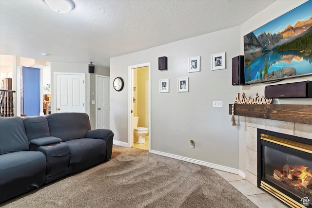 707 W 3675 S, Riverdale, UT 84405 - living room featuring a tile fireplace and baseboards