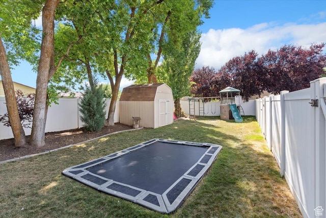 707 W 3675 S, Riverdale, UT 84405 - fenced backyard with a trampoline, a shed, and a playground