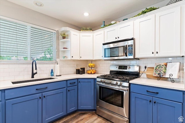 707 W 3675 S, Riverdale, UT 84405 - kitchen featuring appliances with stainless steel finishes, blue cabinets, white cabinets, tasteful backsplash, and recessed lighting