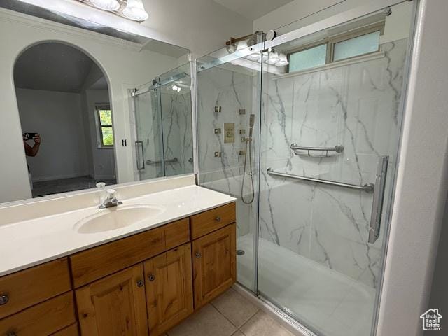943 W Majestic, Logan, UT 84321 - full bath featuring vanity, a marble finish shower, and tile patterned floors