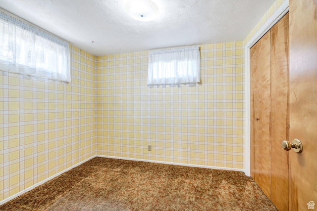 1083 W 10550 S, South Jordan, UT 84095 - spare room featuring dark colored carpet, wallpapered walls, and a textured ceiling
