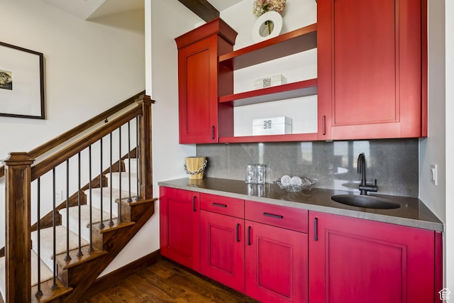 9079 Dye Cabins Dr, Park City, UT 84098 - kitchen featuring red cabinets, dark wood-style floors, open shelves, and tasteful backsplash