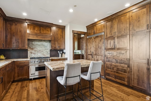 9079 Dye Cabins Dr, Park City, UT 84098 - kitchen featuring designer stove, light countertops, dark wood-type flooring, and recessed lighting