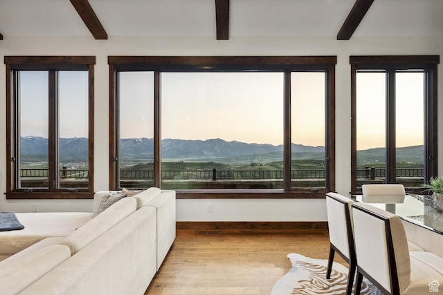 9079 Dye Cabins Dr, Park City, UT 84098 - living area featuring beamed ceiling, wood finished floors, plenty of natural light, and a mountain view