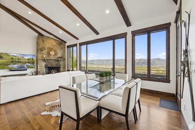 9079 Dye Cabins Dr, Park City, UT 84098 - dining space featuring beamed ceiling, a mountain view, plenty of natural light, a large fireplace, and recessed lighting