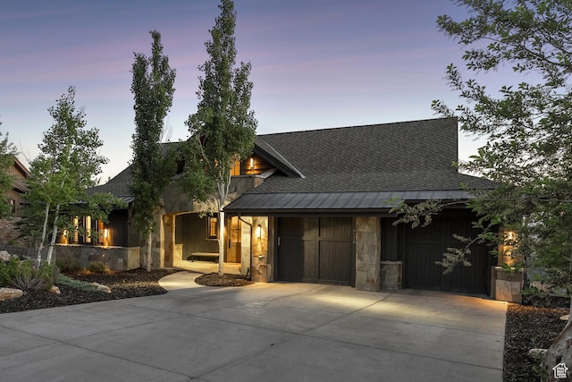 9079 Dye Cabins Dr, Park City, UT 84098 - view of front of house featuring a standing seam roof, driveway, roof with shingles, and stone siding