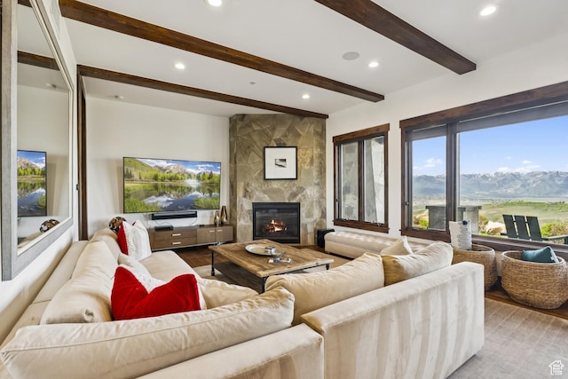 9079 Dye Cabins Dr, Park City, UT 84098 - living room featuring wood finished floors, beamed ceiling, recessed lighting, and a large fireplace