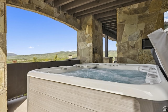 9079 Dye Cabins Dr, Park City, UT 84098 - view of patio with a hot tub and a mountain view