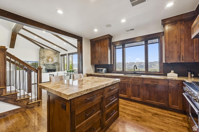 9079 Dye Cabins Dr, Park City, UT 84098 - kitchen with double oven range, dark wood-style floors, recessed lighting, and backsplash