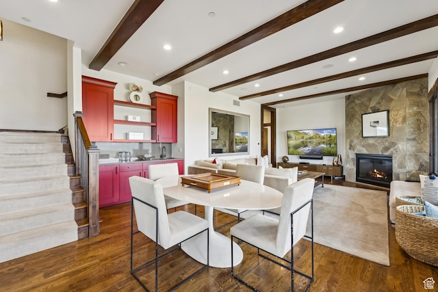 9079 Dye Cabins Dr, Park City, UT 84098 - dining room with dark wood finished floors, recessed lighting, stairway, beamed ceiling, and a tile fireplace
