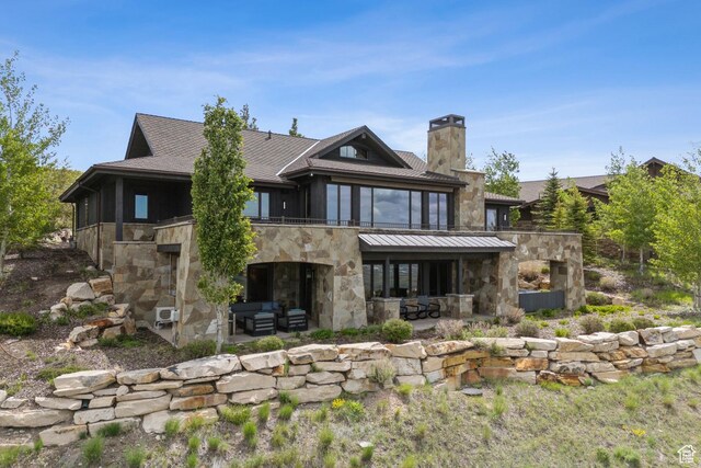 9079 Dye Cabins Dr, Park City, UT 84098 - rear view of property featuring stone siding, a chimney, and a patio area