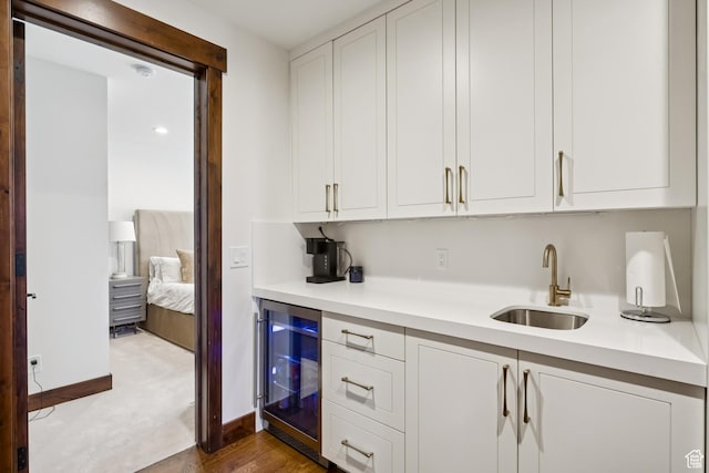 9079 Dye Cabins Dr, Park City, UT 84098 - kitchen featuring wine cooler, light countertops, white cabinets, and carpet floors