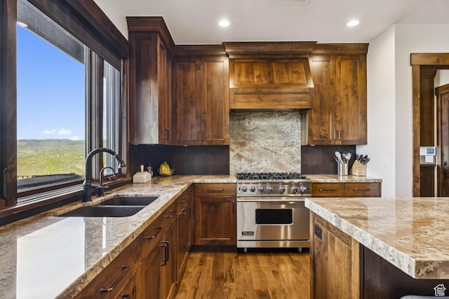 9079 Dye Cabins Dr, Park City, UT 84098 - kitchen with designer stove, custom range hood, dark wood-style flooring, recessed lighting, and tasteful backsplash