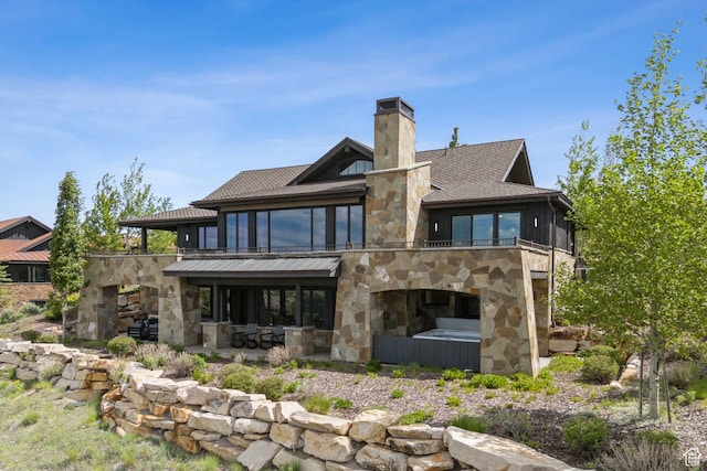 9079 Dye Cabins Dr, Park City, UT 84098 - rear view of house with stone siding, a chimney, and a patio area