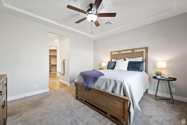 886 N Sandy Talus Dr, Washington, UT 84780 - bedroom featuring carpet floors, a tray ceiling, and a ceiling fan