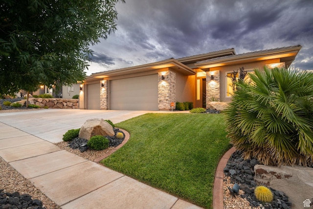 886 N Sandy Talus Dr, Washington, UT 84780 - view of front of house featuring stone siding, a garage, driveway, a front yard, and stucco siding