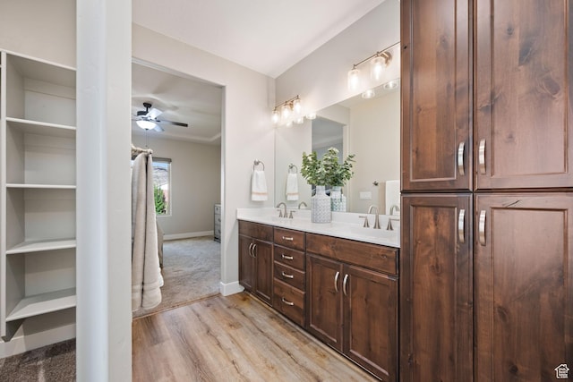 886 N Sandy Talus Dr, Washington, UT 84780 - full bathroom featuring double vanity, wood finished floors, and ceiling fan