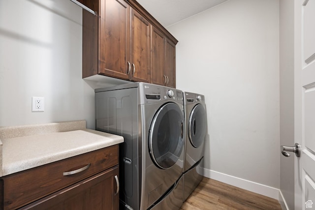 886 N Sandy Talus Dr, Washington, UT 84780 - washroom with cabinet space, independent washer and dryer, and light wood-style flooring