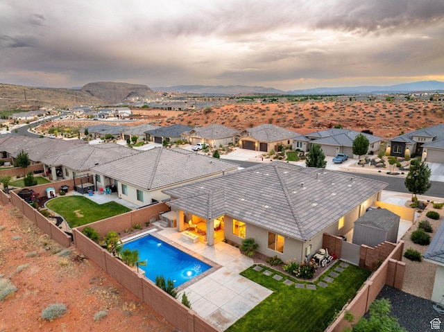 886 N Sandy Talus Dr, Washington, UT 84780 - view of swimming pool featuring a fenced backyard, a mountain view, a patio, and a residential view