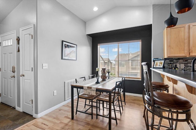 1049 W Allington Dr N, North Salt Lake, UT 84054 - dining space with vaulted ceiling and wood finished floors