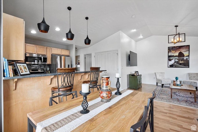1049 W Allington Dr N, North Salt Lake, UT 84054 - dining room featuring light wood-type flooring, lofted ceiling, recessed lighting, and a chandelier