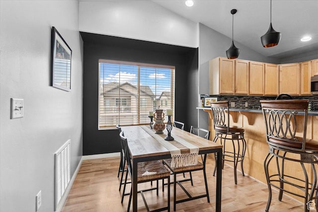 1049 W Allington Dr N, North Salt Lake, UT 84054 - dining room with light wood-style floors, vaulted ceiling, and recessed lighting