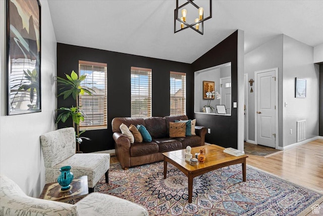 1049 W Allington Dr N, North Salt Lake, UT 84054 - living area with a chandelier, wood finished floors, plenty of natural light, and vaulted ceiling