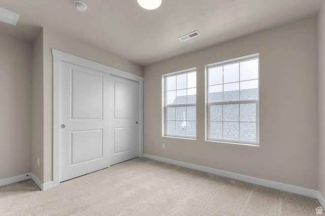 7007 W Granbury Dr, South Jordan, UT 84009 - unfurnished bedroom with light colored carpet and a closet