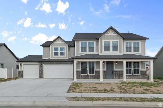 1918 S 2475 W, West Haven, UT 84401 - craftsman house with board and batten siding, concrete driveway, a porch, and brick siding