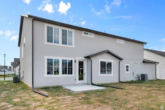 1918 S 2475 W, West Haven, UT 84401 - rear view of property with stucco siding, a patio, and a yard
