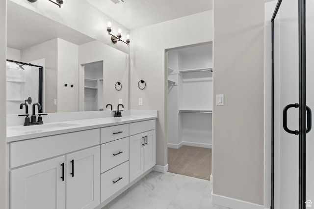 1918 S 2475 W, West Haven, UT 84401 - full bath featuring a walk in closet, double vanity, marble look tiles, and a shower stall