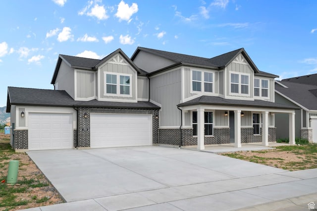 1918 S 2475 W, West Haven, UT 84401 - view of front facade featuring a porch, board and batten siding, a garage, concrete driveway, and a shingled roof
