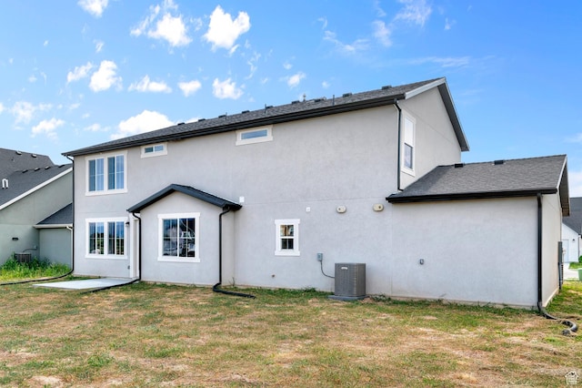 1918 S 2475 W, West Haven, UT 84401 - back of property with stucco siding, a lawn, and a patio area
