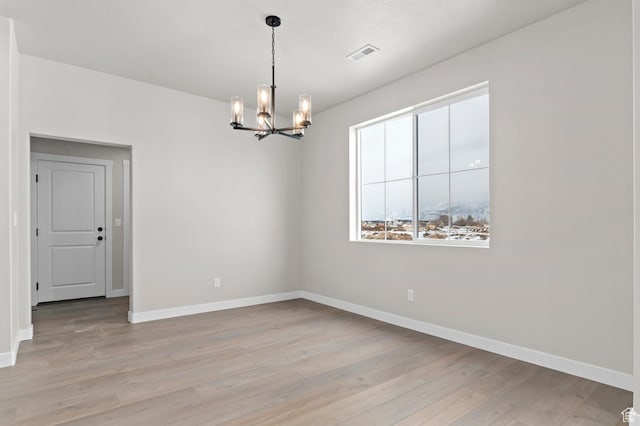 1918 S 2475 W, West Haven, UT 84401 - unfurnished room featuring a chandelier and light wood-style flooring