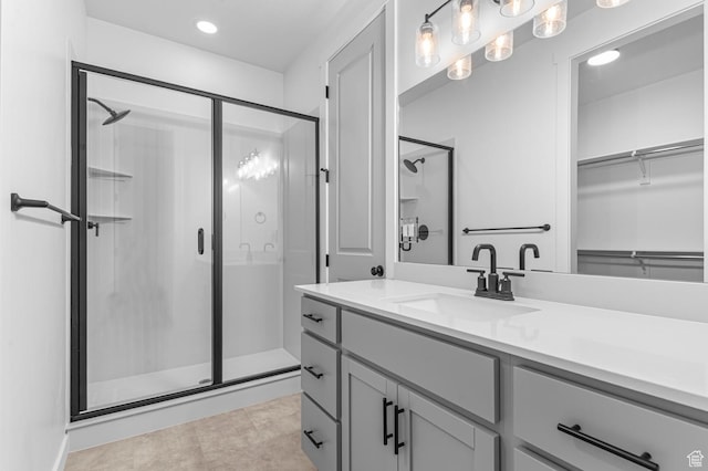 3908 W 2720 N, Lehi, UT 84043 - bathroom with a shower stall, vanity, recessed lighting, a walk in closet, and tile patterned floors