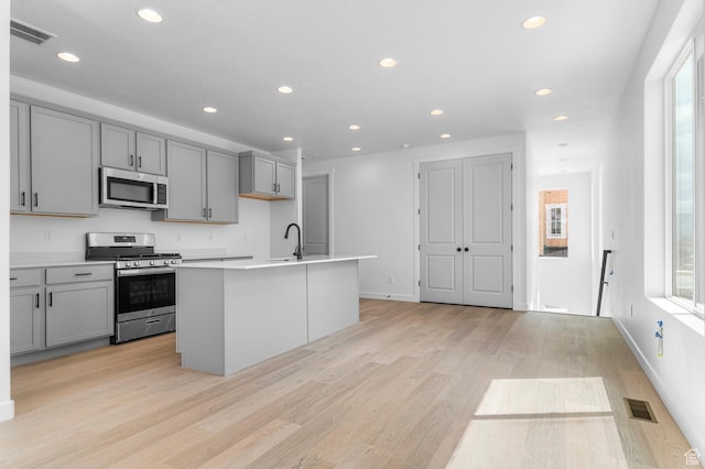 3908 W 2720 N, Lehi, UT 84043 - kitchen with stainless steel appliances, gray cabinetry, healthy amount of natural light, and recessed lighting