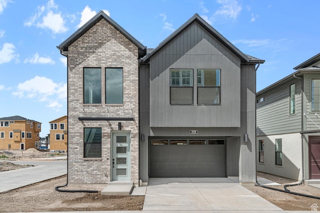 3908 W 2720 N, Lehi, UT 84043 - modern home featuring driveway, brick siding, and an attached garage